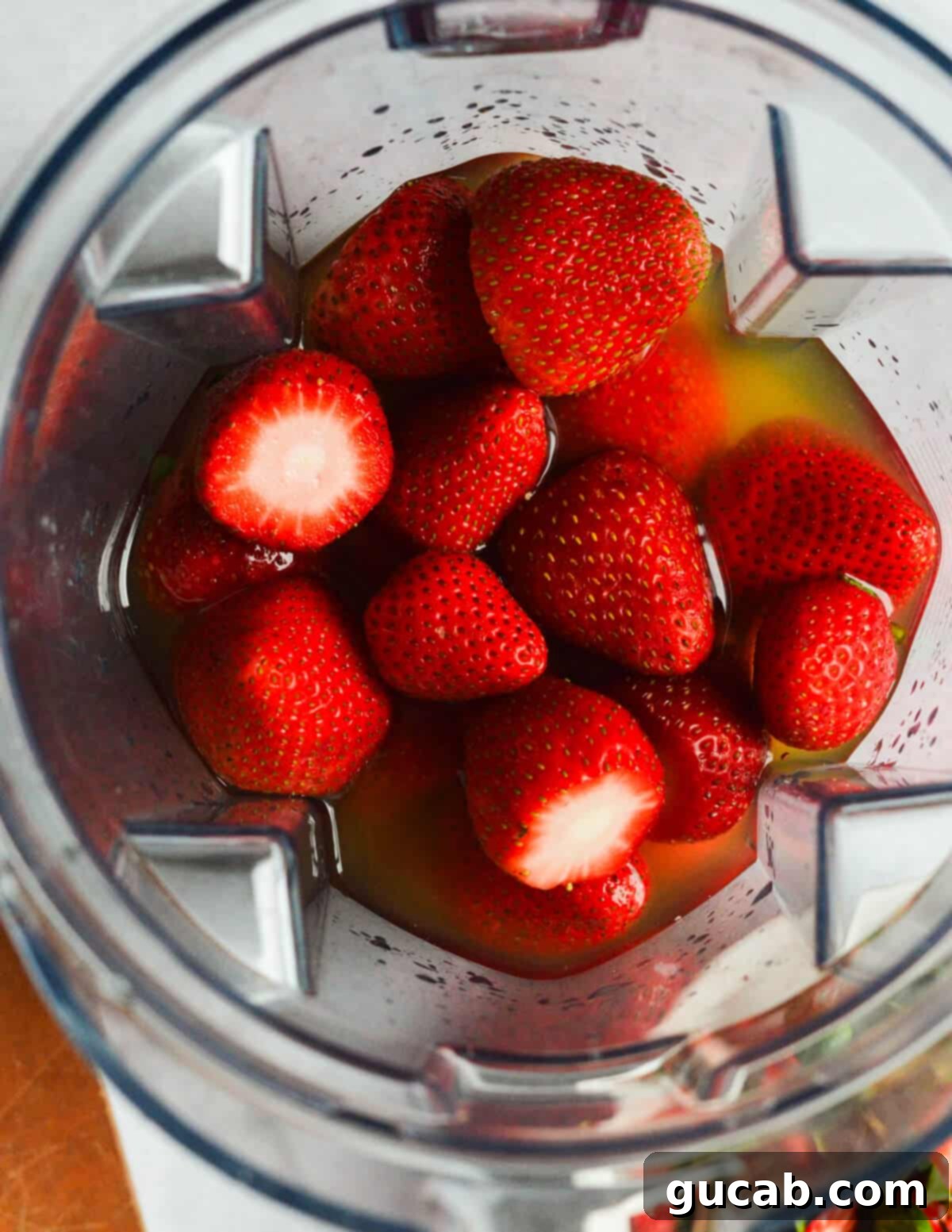 Strawberry Passion Zing 4 strawberries and passion fruit juice in a blender.