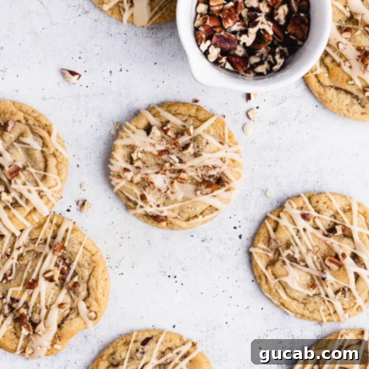 maple cookies with pecans and a drizzle on top. 