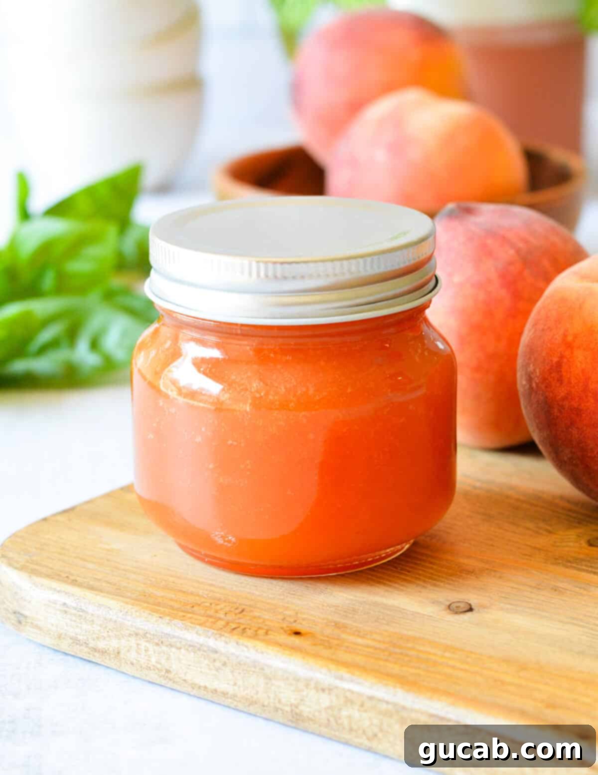 a jar of peach syrup.