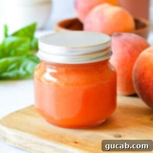 a jar of peach basil syrup.
