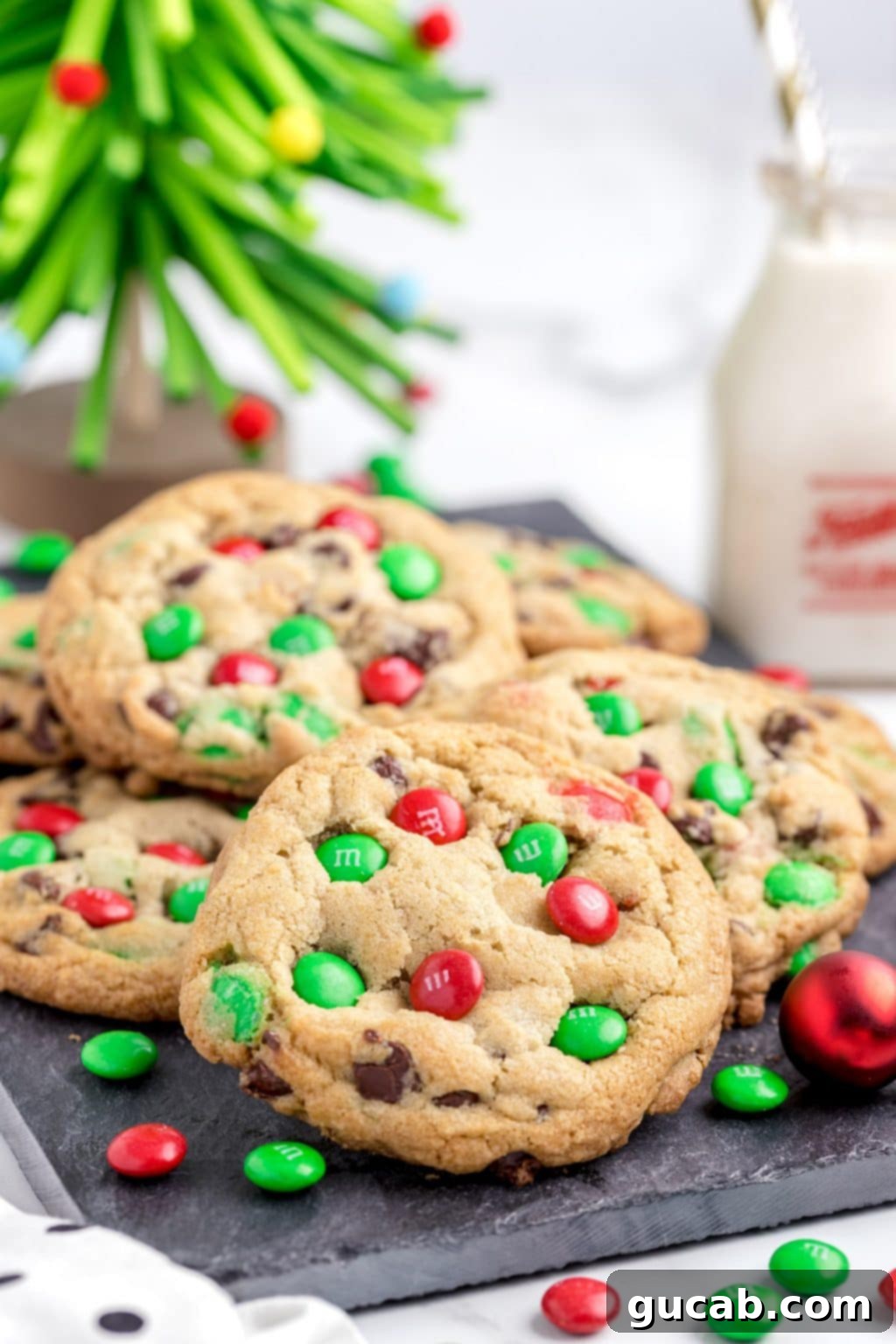 a pile of red and green M&M cookies. 