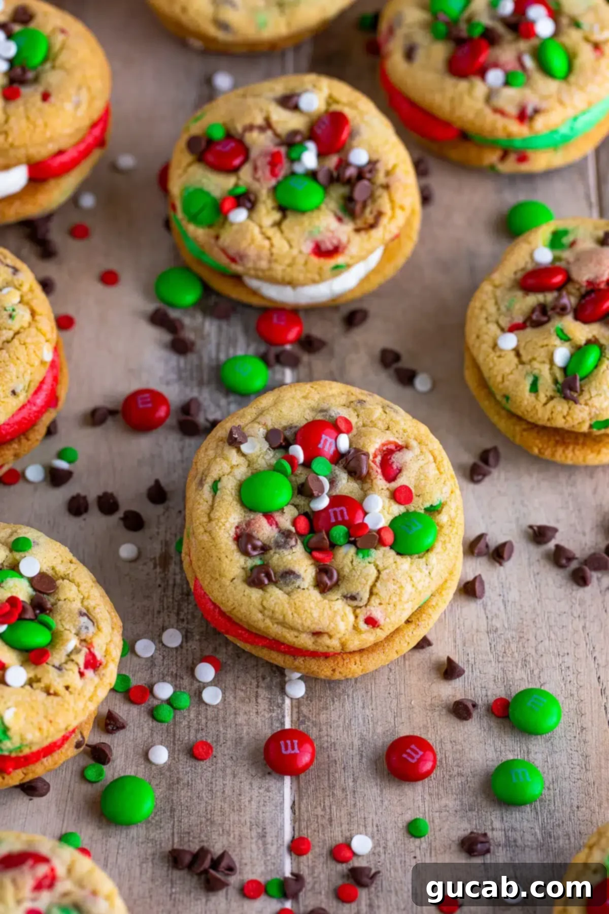 chocolate chip sandwich cookies with christmas sprinkles and red and green buttercream filling. 