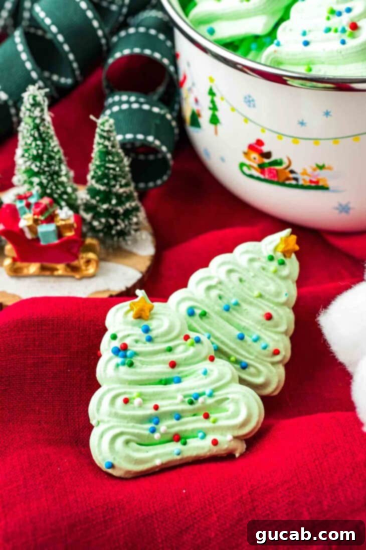 christmas tree meringue cookies on red fabric. 