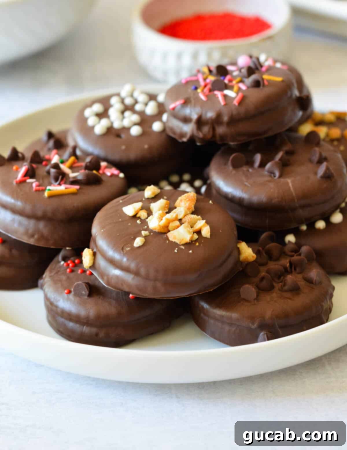 a plate of chocolate dipped ritz cookies. 