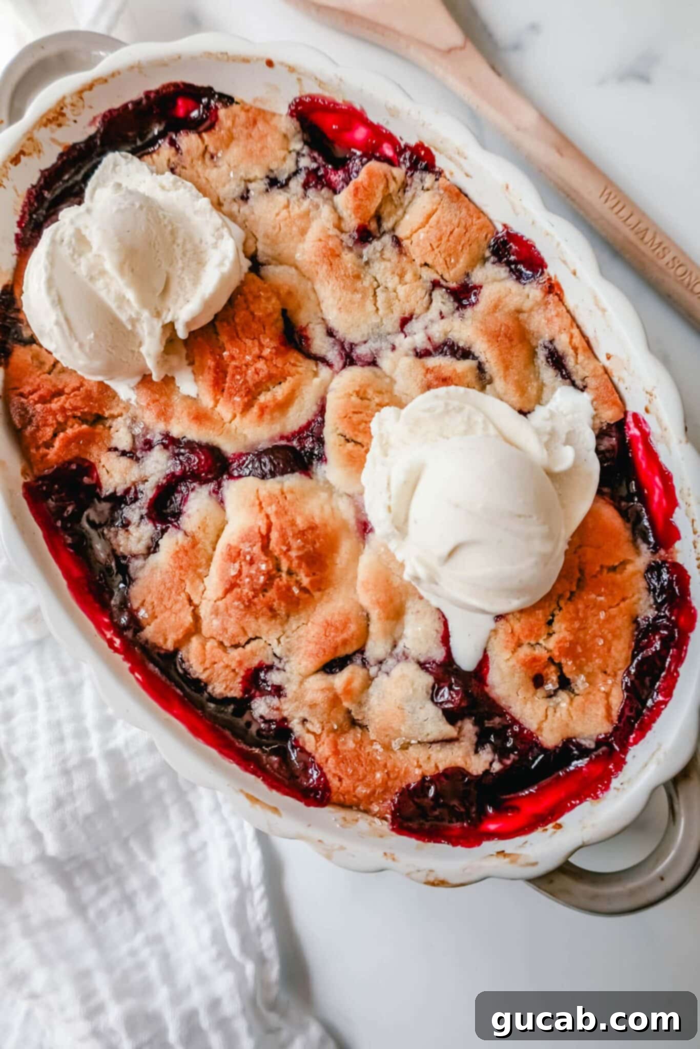 cherry cobbler with ice cream on top.