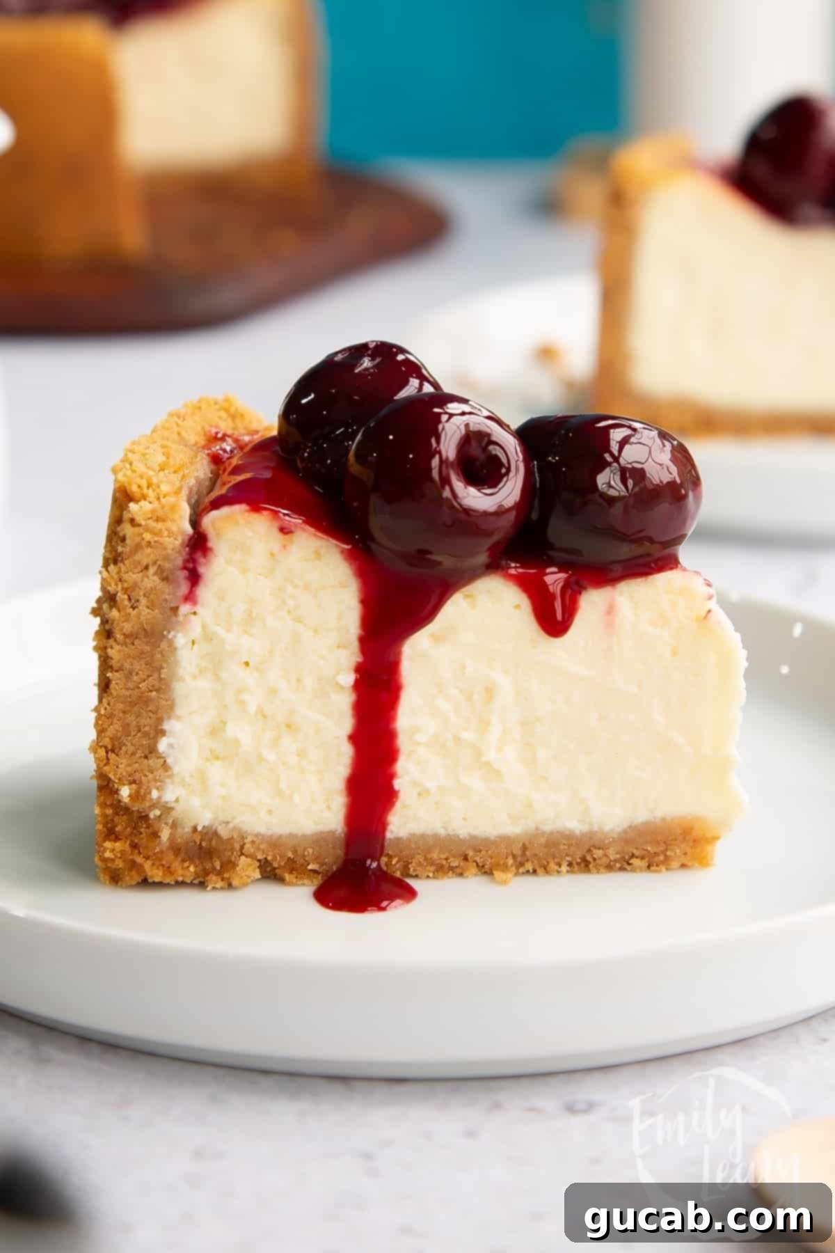 a slice of cheesecake with cherries on top.