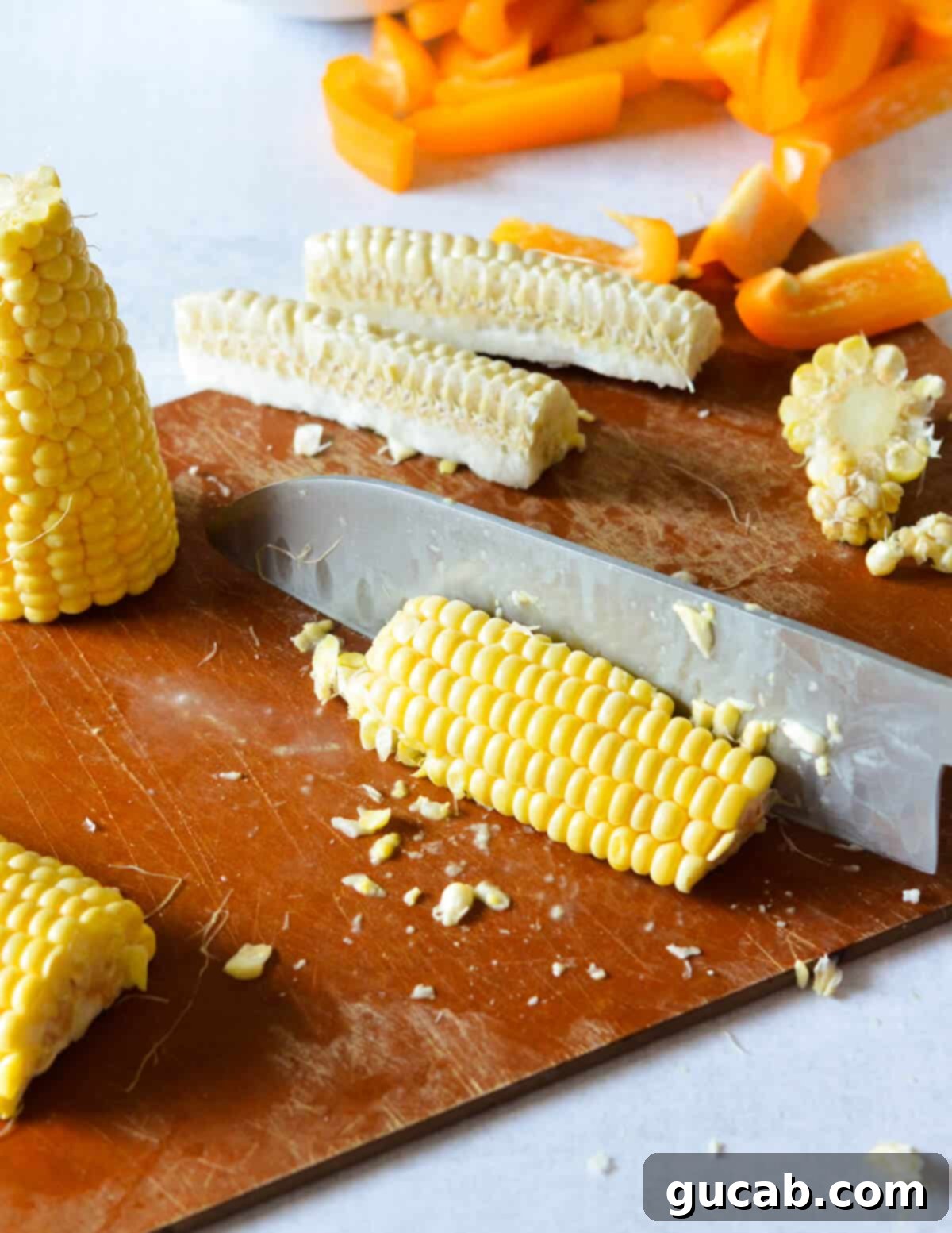 A knife expertly cutting corn into 