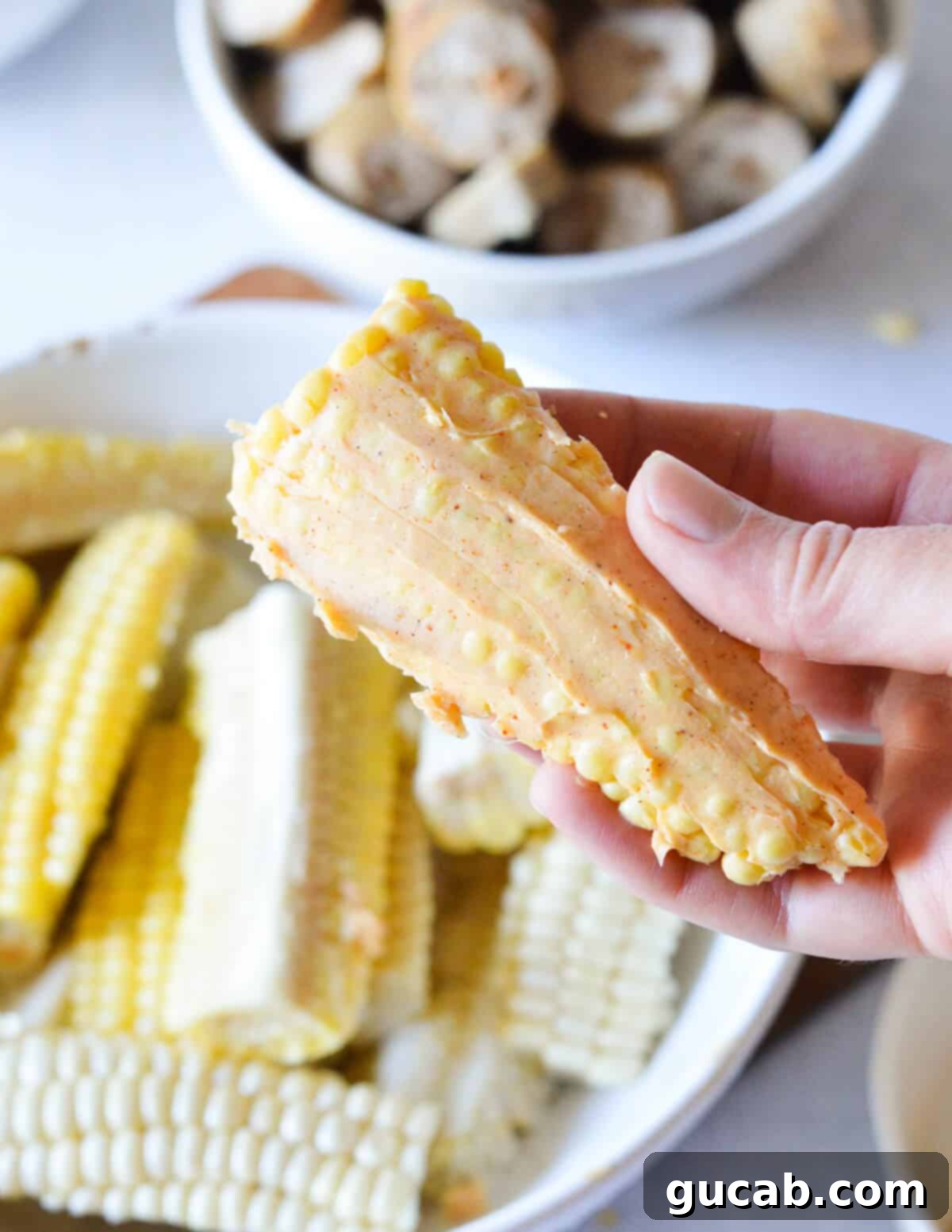 A single corn rib generously slathered in the flavorful chili butter, showcasing its potential for caramelization and taste.