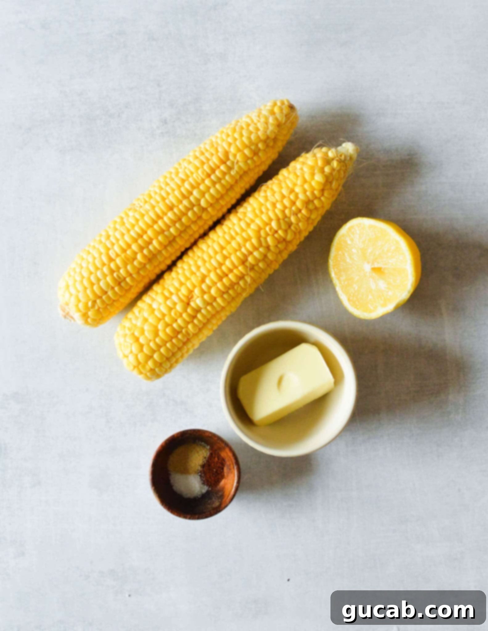 corn cobs, butter, seasoning, lemon. 