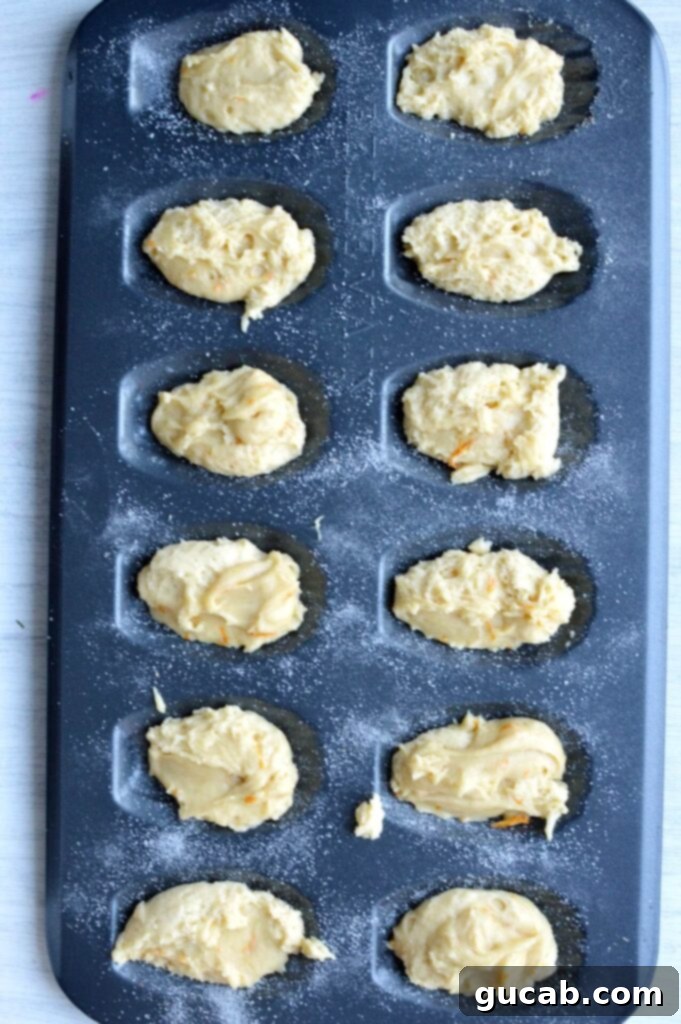 Irresistible Gluten-Free Madeleines 4 Madeleine pan with individual molds filled precisely two-thirds full with madeleine batter.