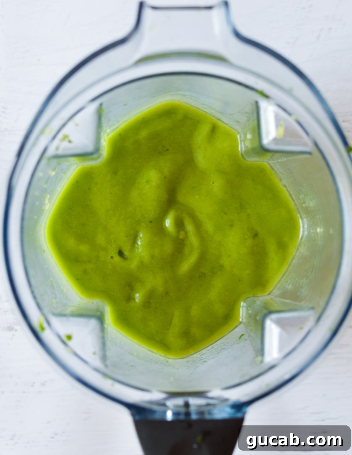 Panera's Emerald Zest Smoothie 5 The blender in action, showing the ingredients transforming into a smooth, vibrant green liquid. This image highlights the blending process for the green passion smoothie.