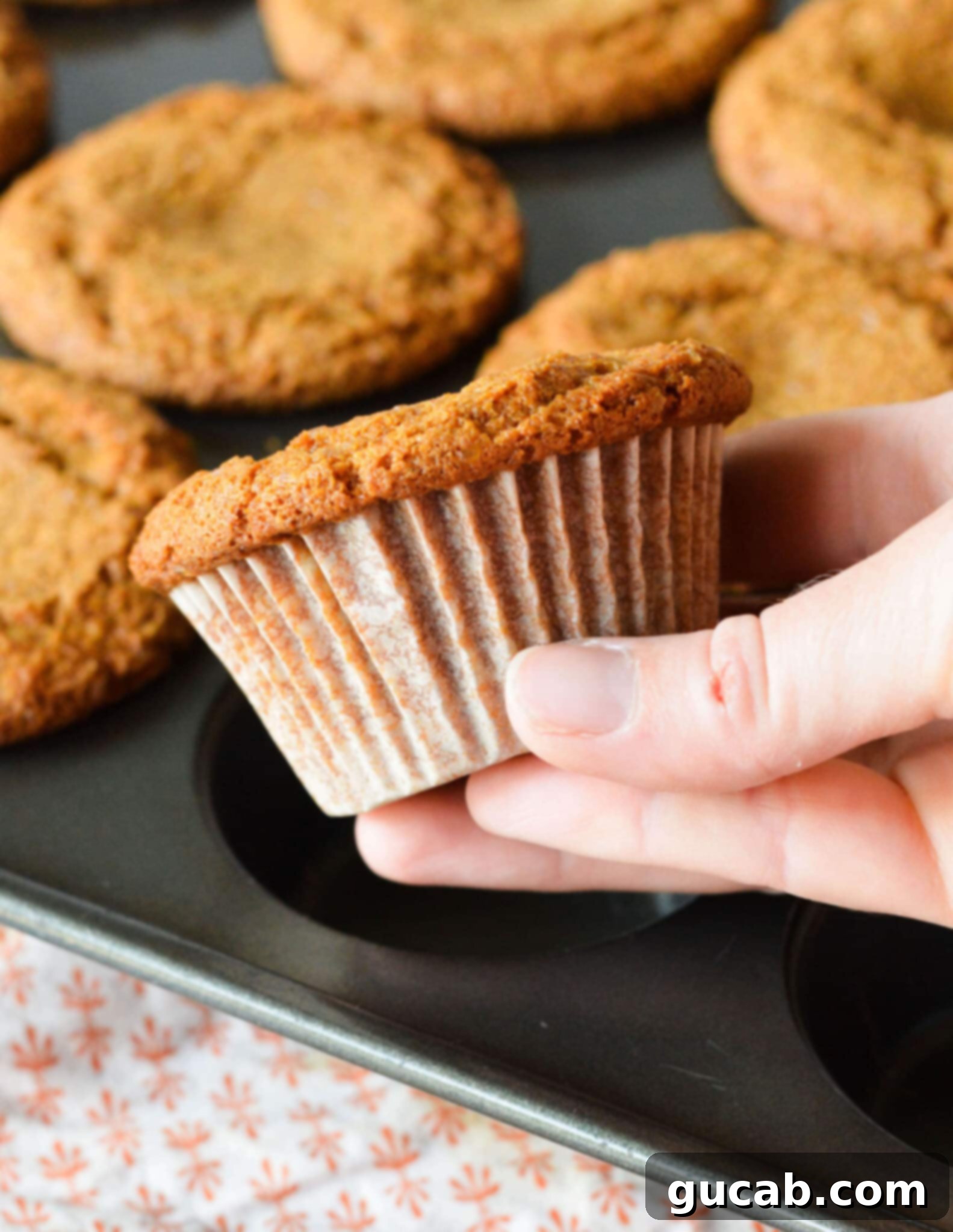 hand holding a gingerbread muffin 