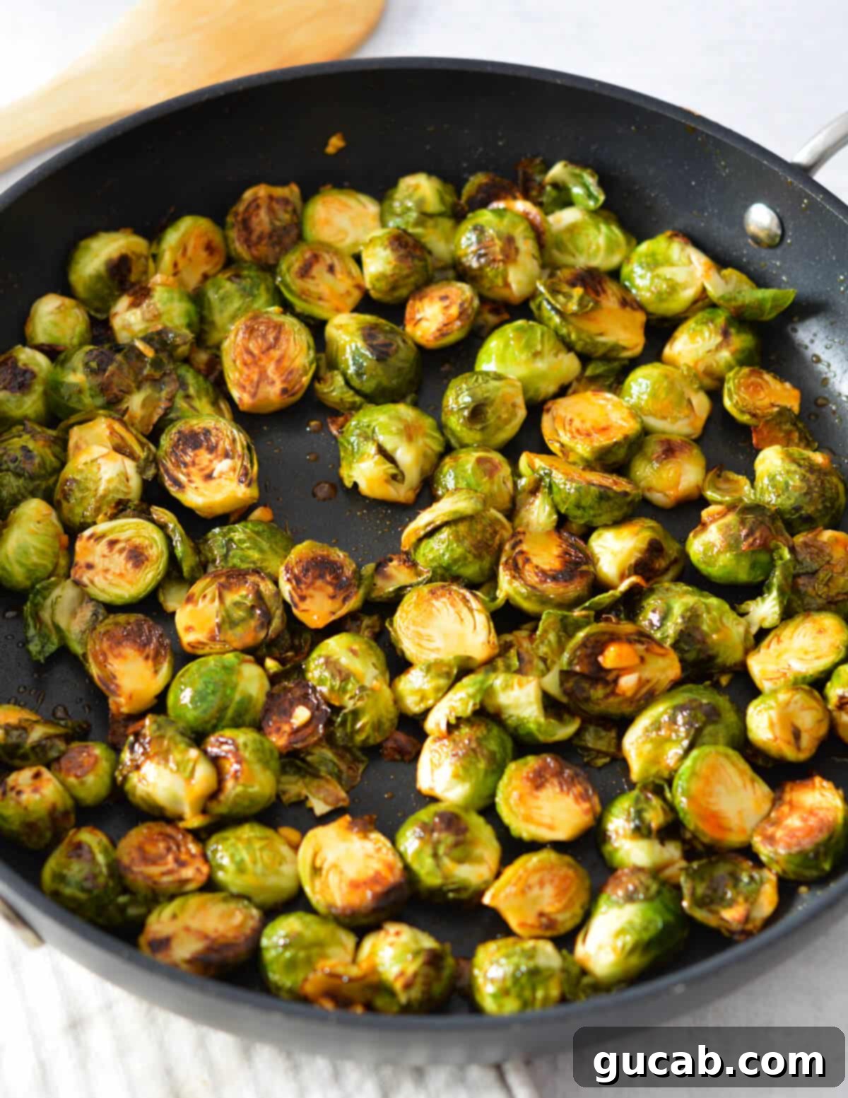 sriracha brussels sprouts in a skillet.