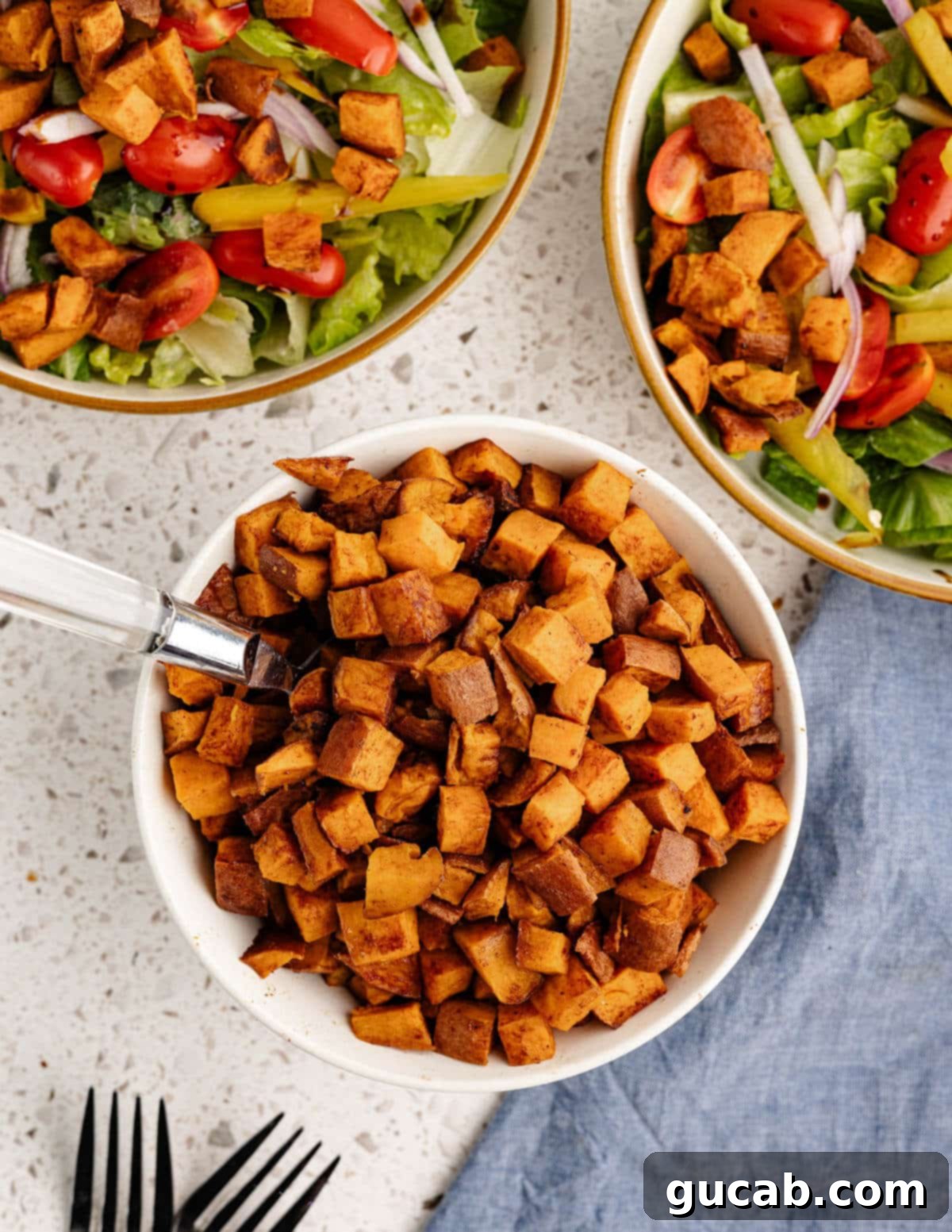 a bowl of cinnamon roasted sweet potatoes. 