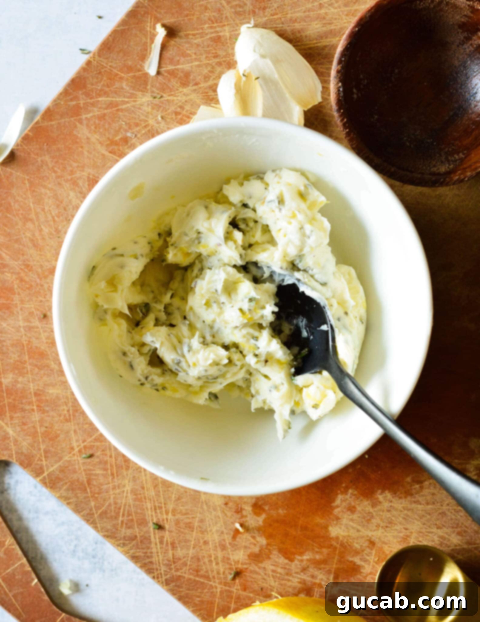 Aromatic Rosemary Garlic Butter 7 The finished rosemary garlic butter beautifully blended in a bowl, showcasing its rich texture and flecks of herbs.