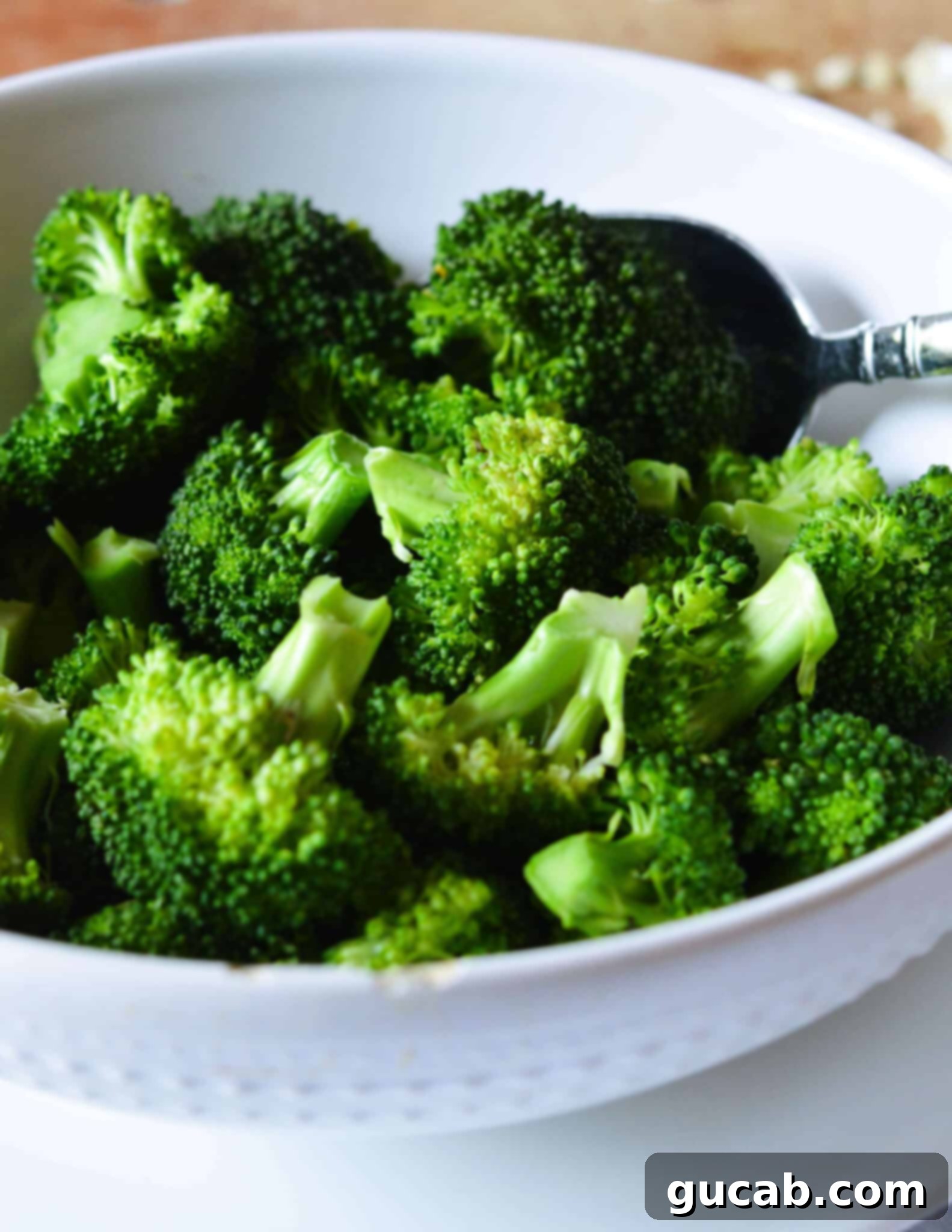 Easy 10-Minute Garlic Butter Broccoli 10 A bowl of perfectly steamed, vibrant green broccoli florets, ready for the garlic butter.