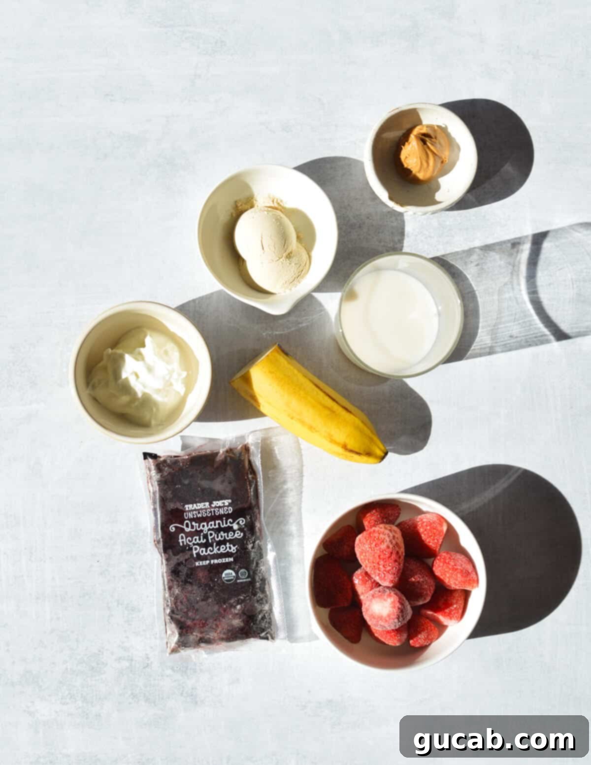 peanut butter, vanilla protein, banana, almond milk, Greek yogurt, frozen acai, frozen strawberries. 