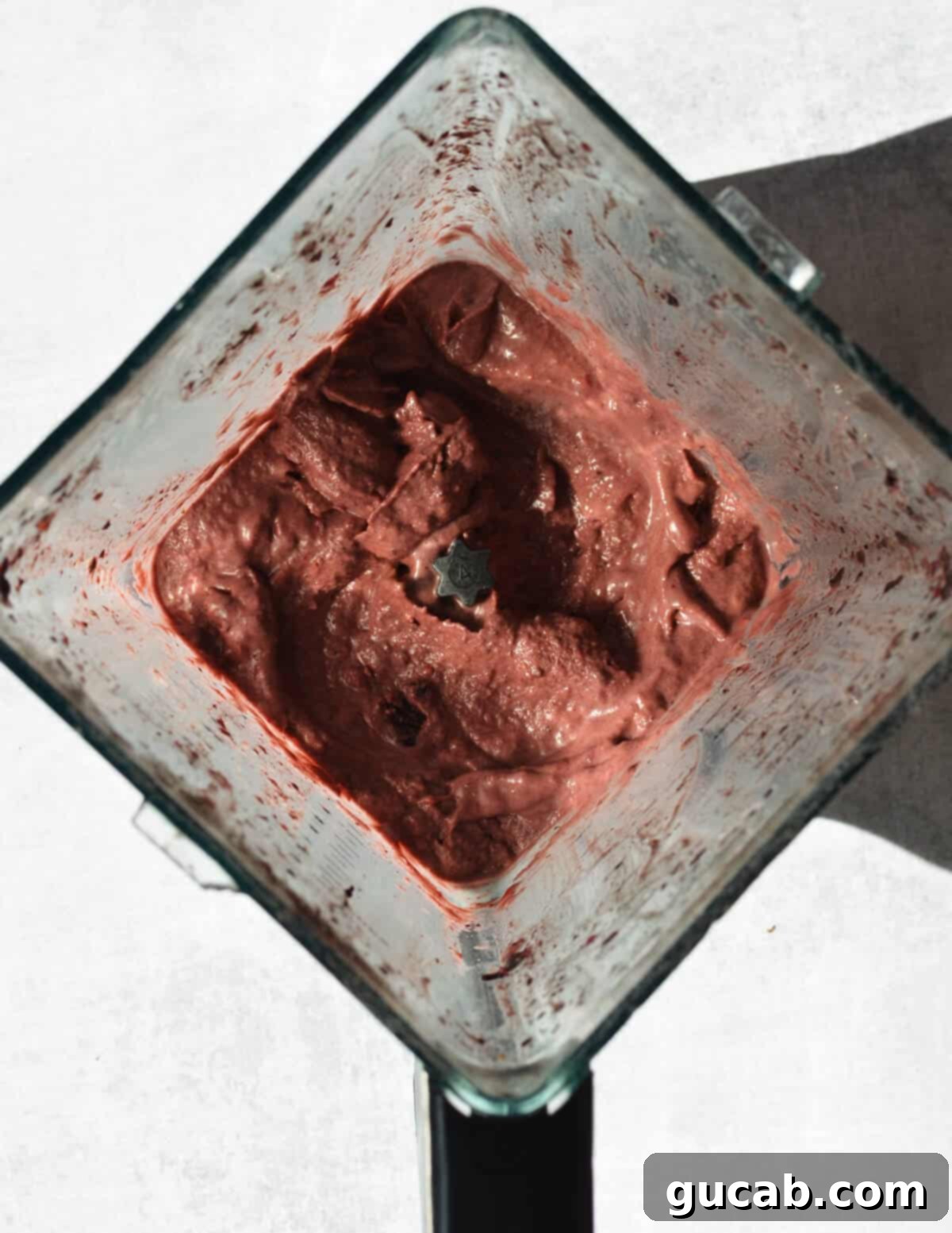 Protein Packed Acai Bowl 6 thick strawberry acai smoothie in a blender.