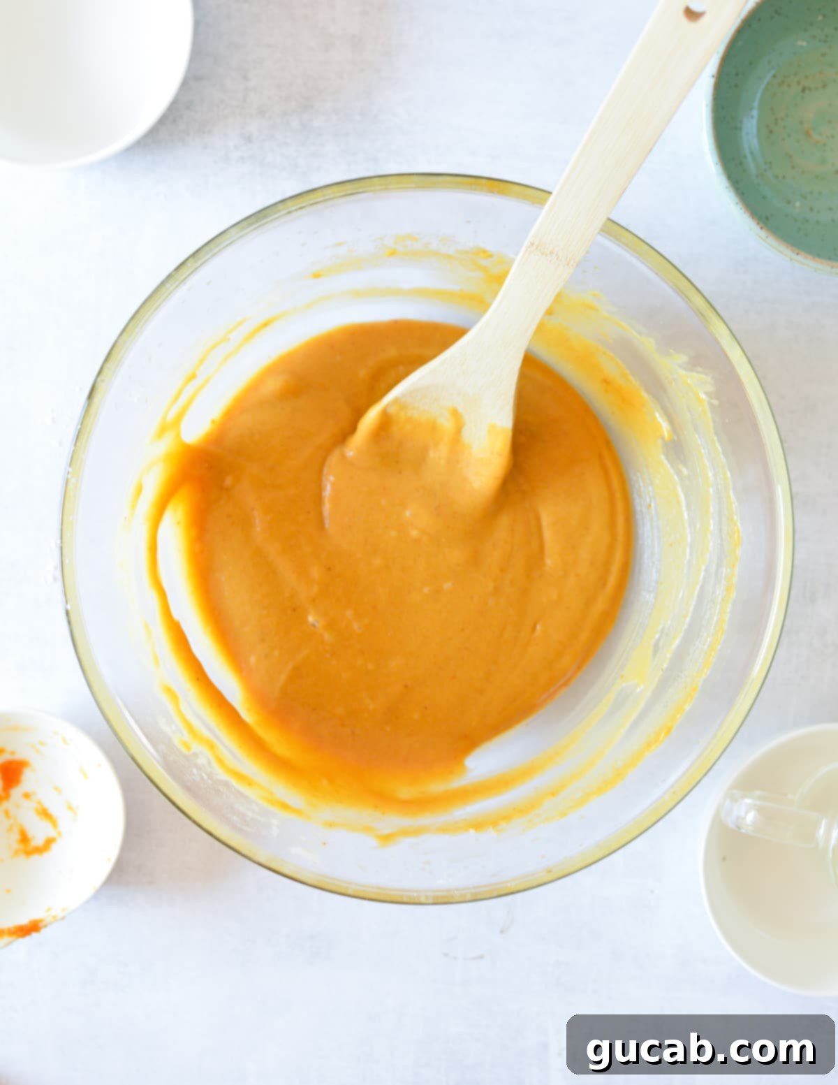 The smooth, thick consistency of the fully mixed gluten-free pumpkin batter.