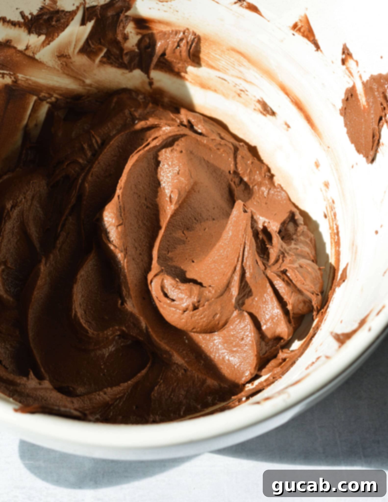 a bowl of whipped chocolate frosting.