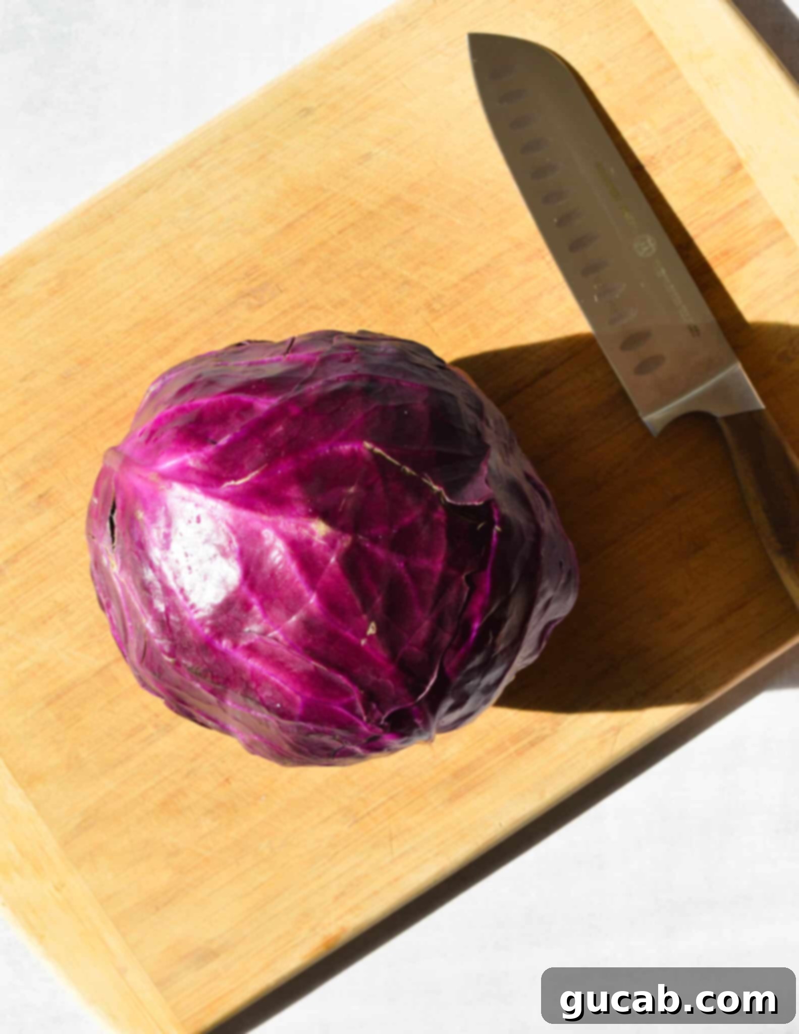 head of cabbage on a cutting board. 