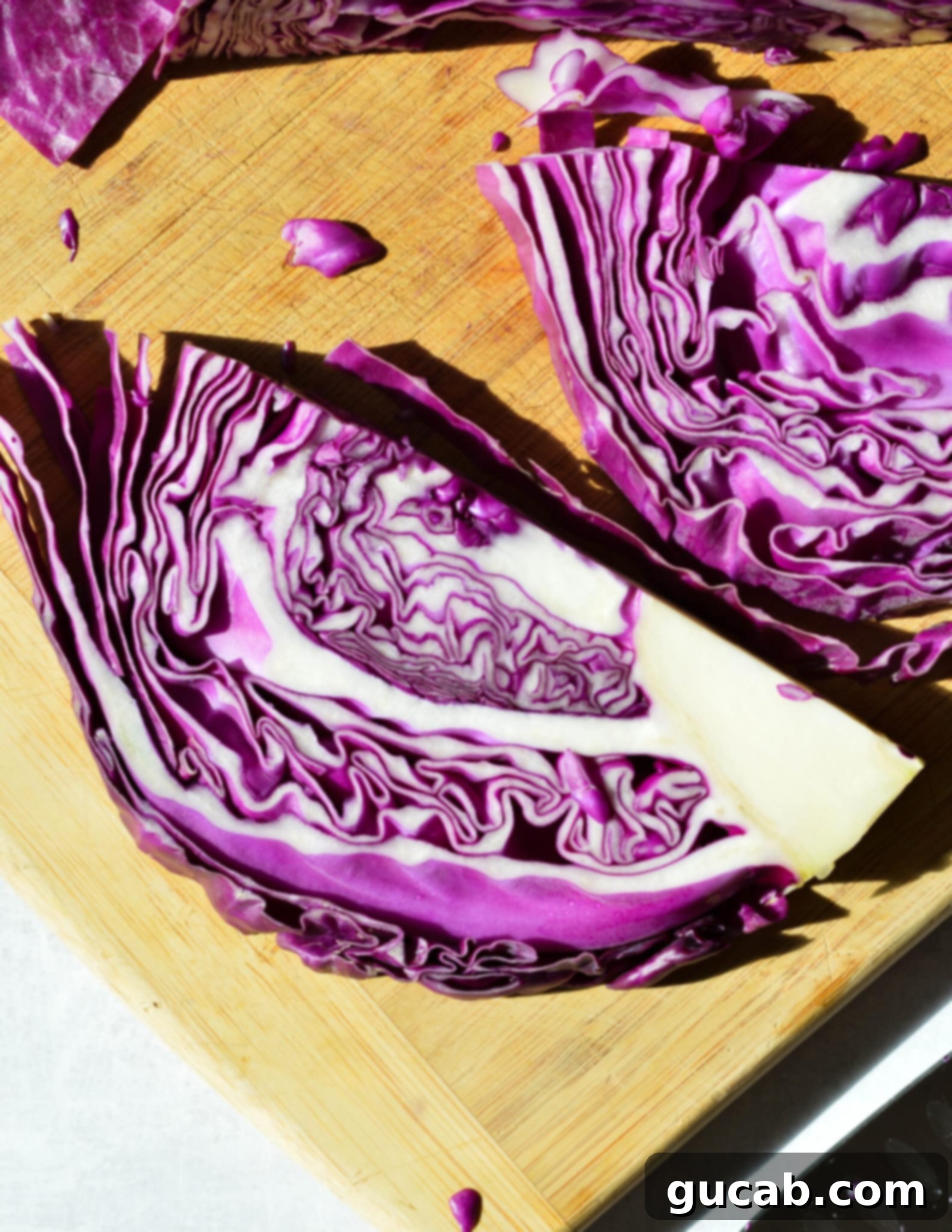 sliced cabbage on a cutting board.