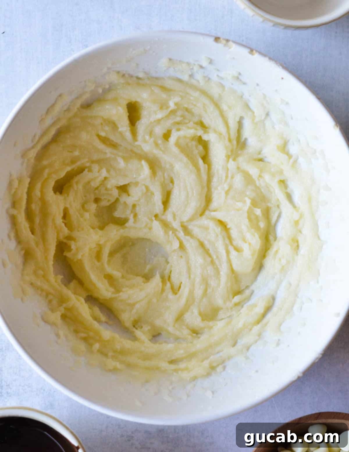 Creamed butter and sugar in a mixing bowl, light and fluffy.