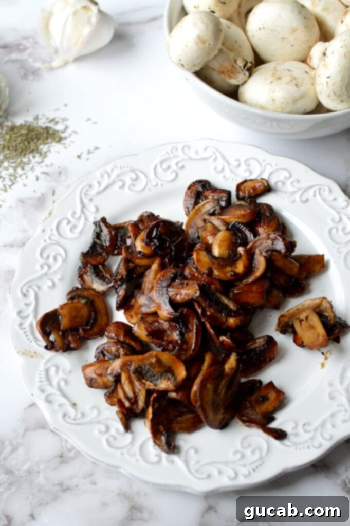 Sweet and Savory Balsamic Glazed Mushrooms 2 A plate of perfectly caramelized mushrooms, glistening with a balsamic glaze.