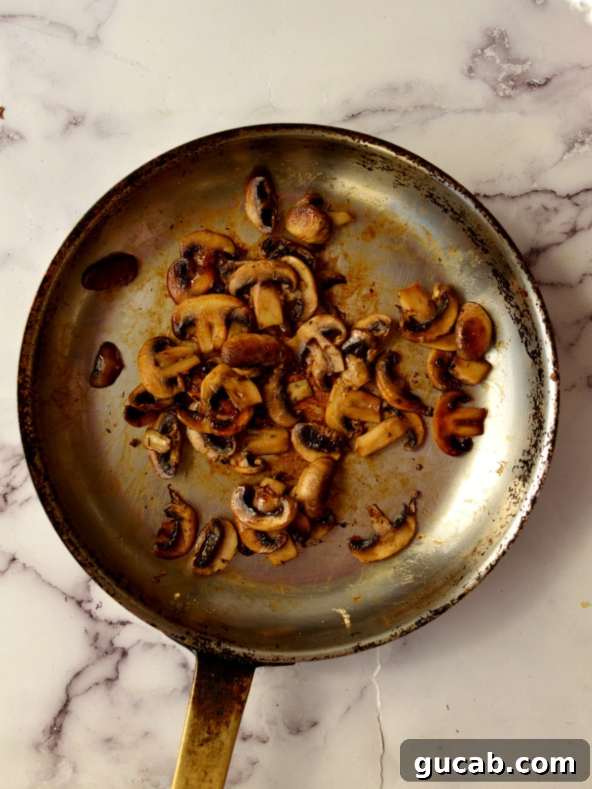 Sweet and Savory Balsamic Glazed Mushrooms 6 A pan of caramelized mushrooms with balsamic vinegar and other liquids just added, creating a glossy sauce.