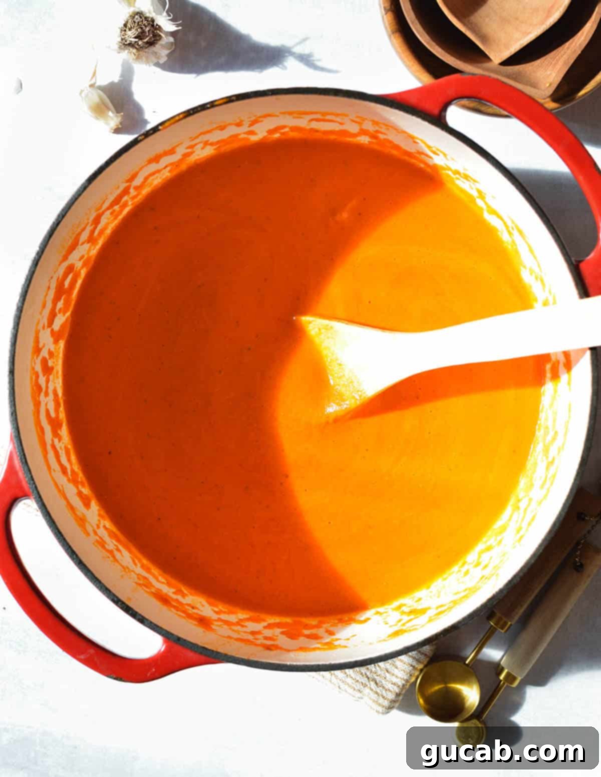 Roasted red pepper soup in a Dutch oven, finished and ready to serve.