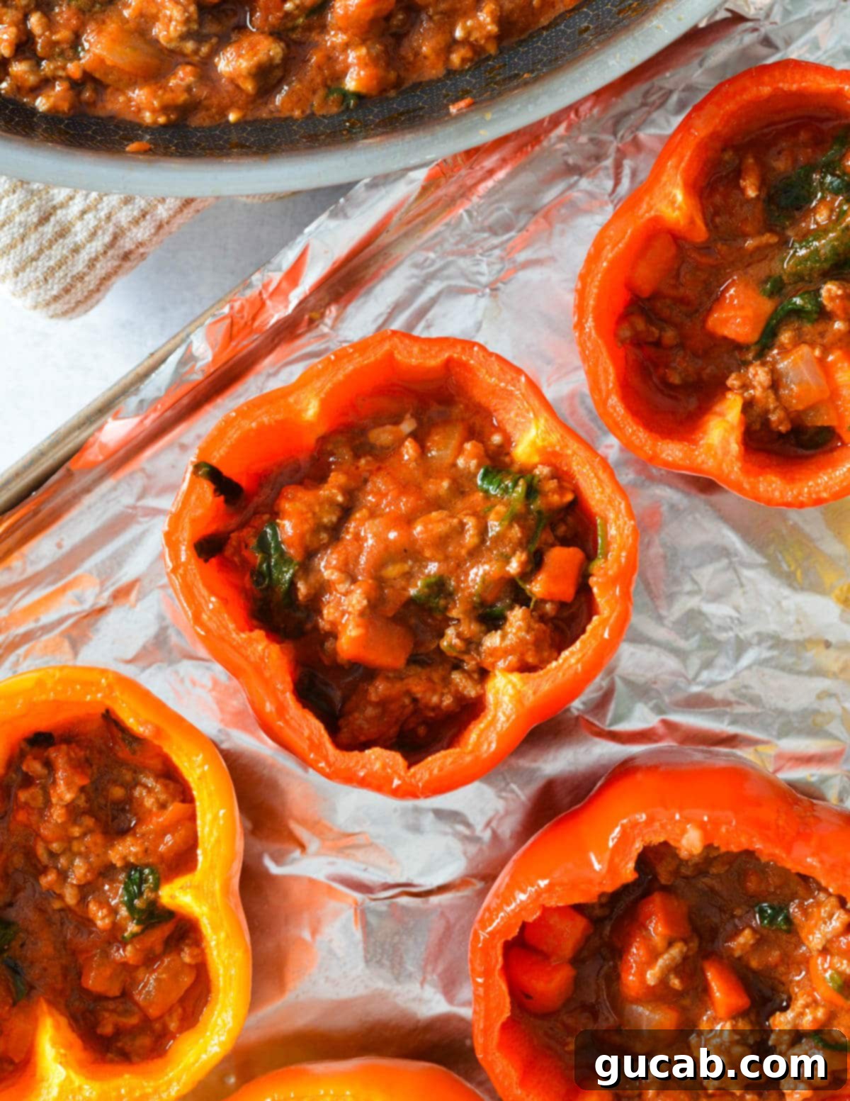Bell peppers filled three-quarters of the way with a rich meat sauce.