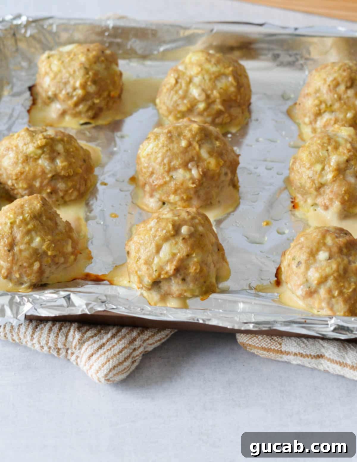 cooked turkey meatballs on a sheet pan. 
