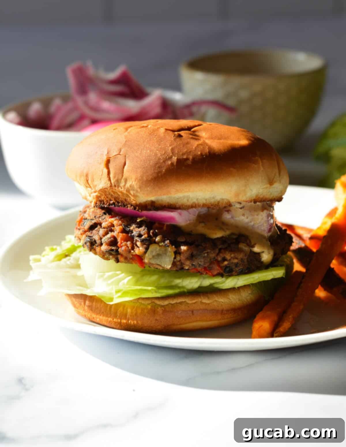 black bean burger with sweet potato fries. 