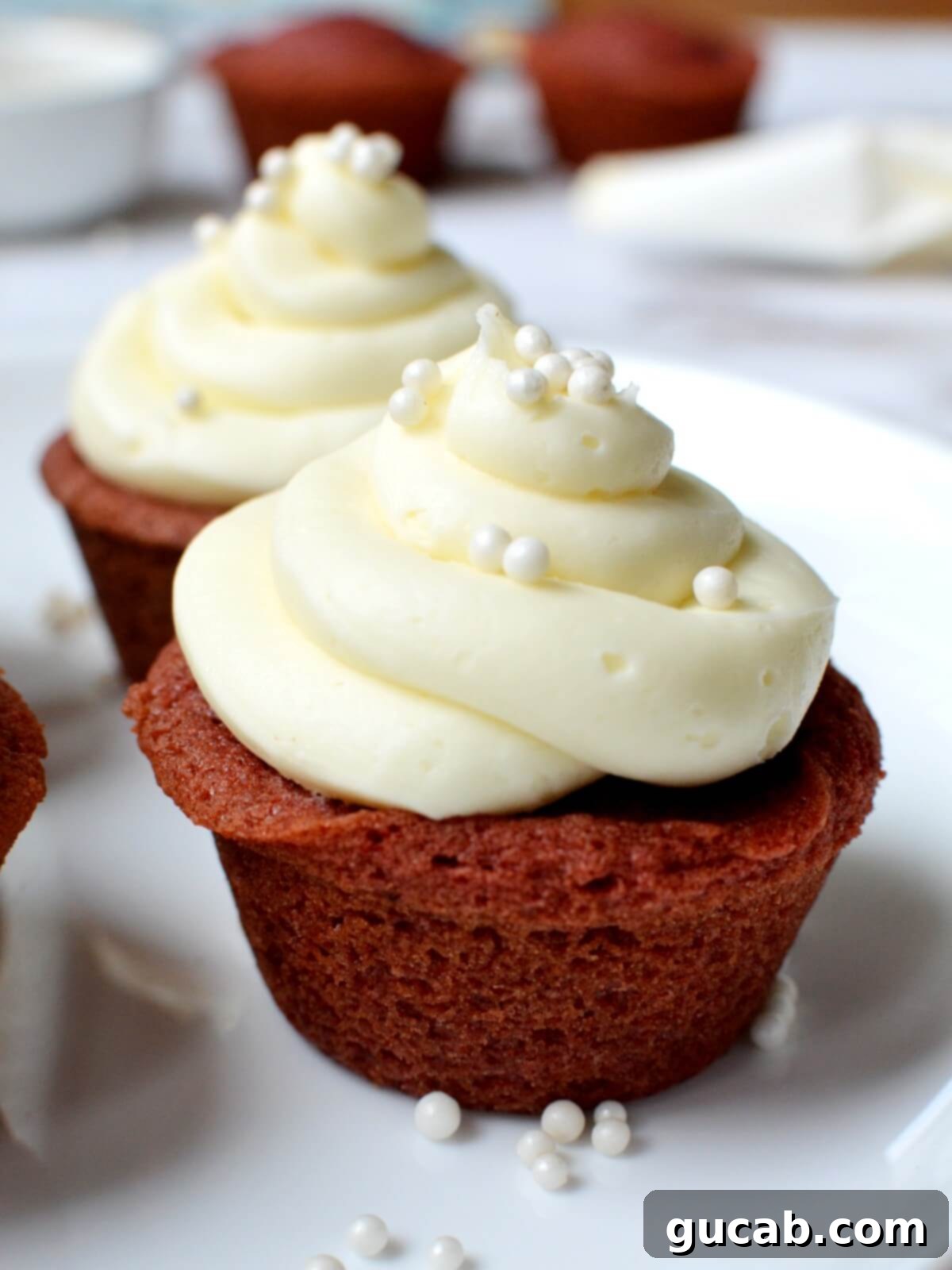 Decadent Gluten-Free Red Velvet Cupcakes 2 gluten free red velvet cupcakes with cream cheese frosting