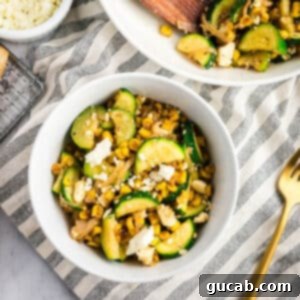 a bowl of sauteed zucchini with corn and feta