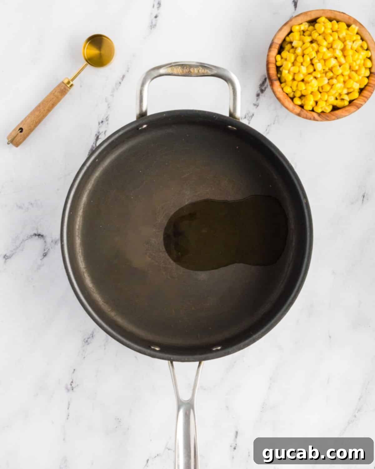 Olive oil glistening in a hot skillet, ready for cooking.