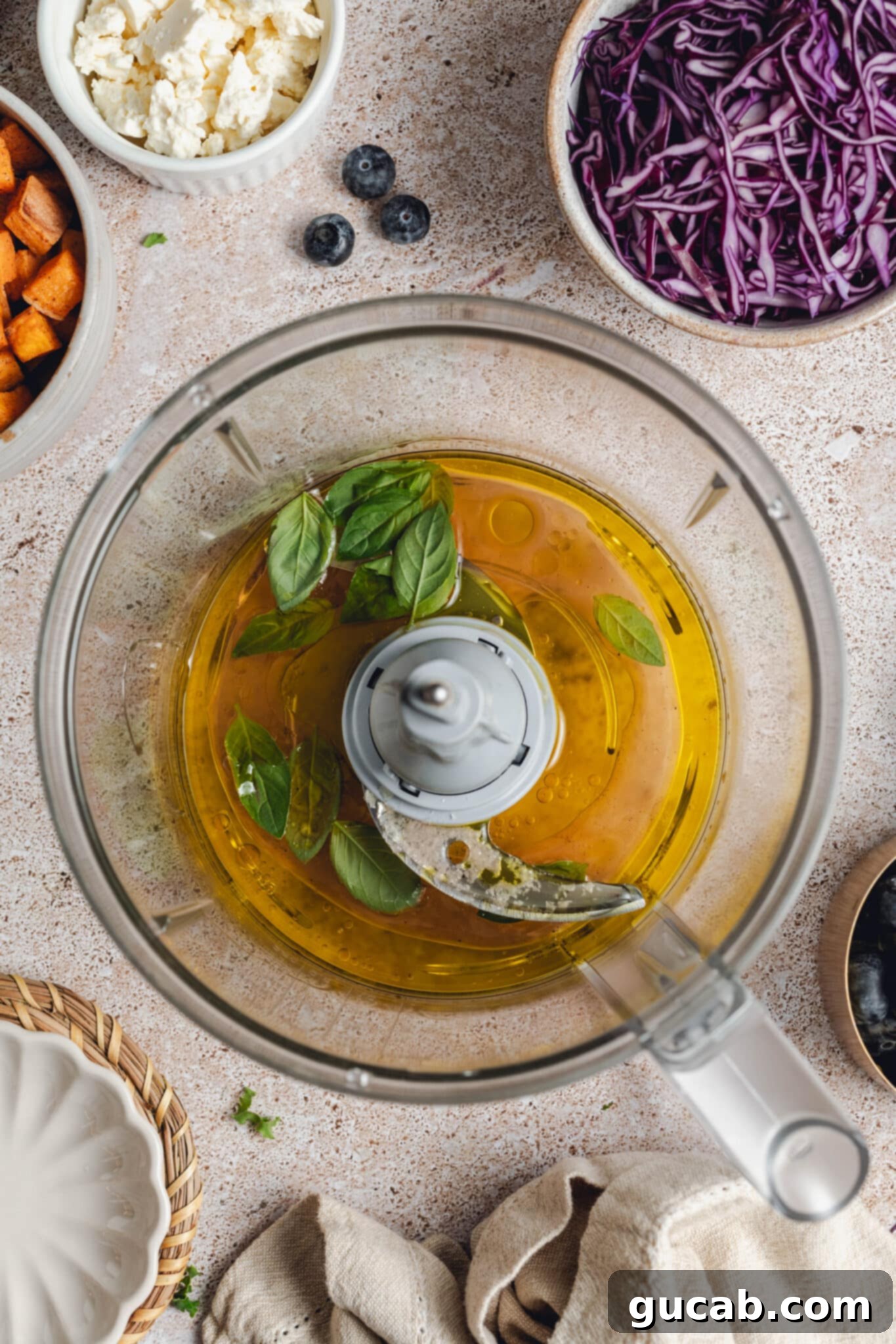 basil, olive oil, red wine vinegar, and honey in a food processor.