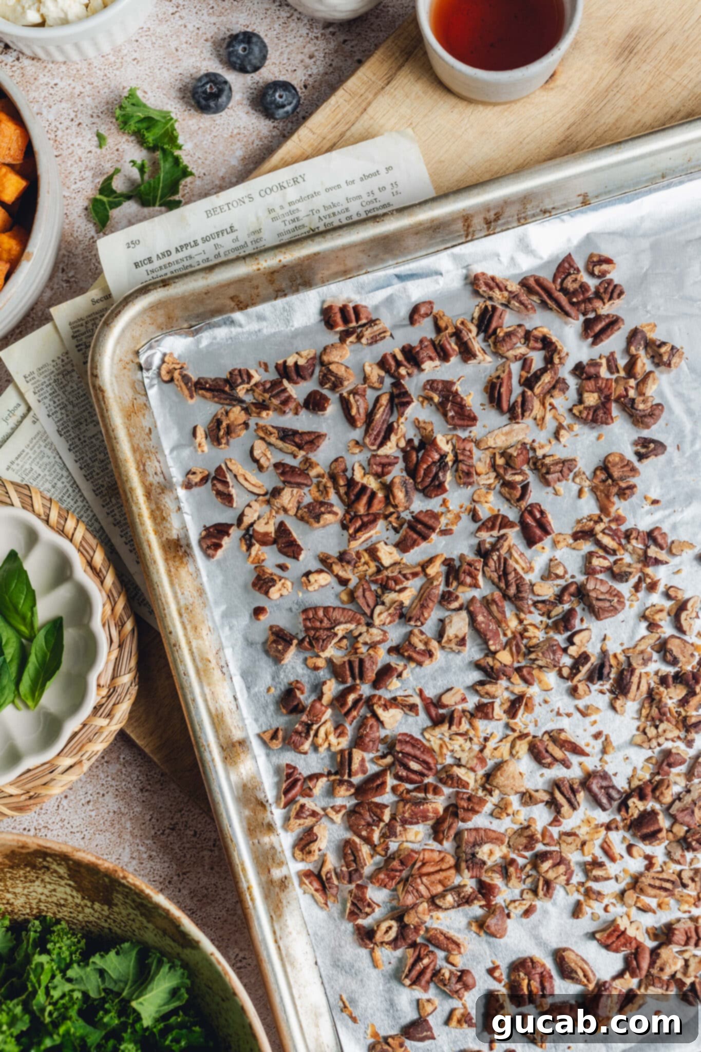 toasted pecans on a sheet pan.