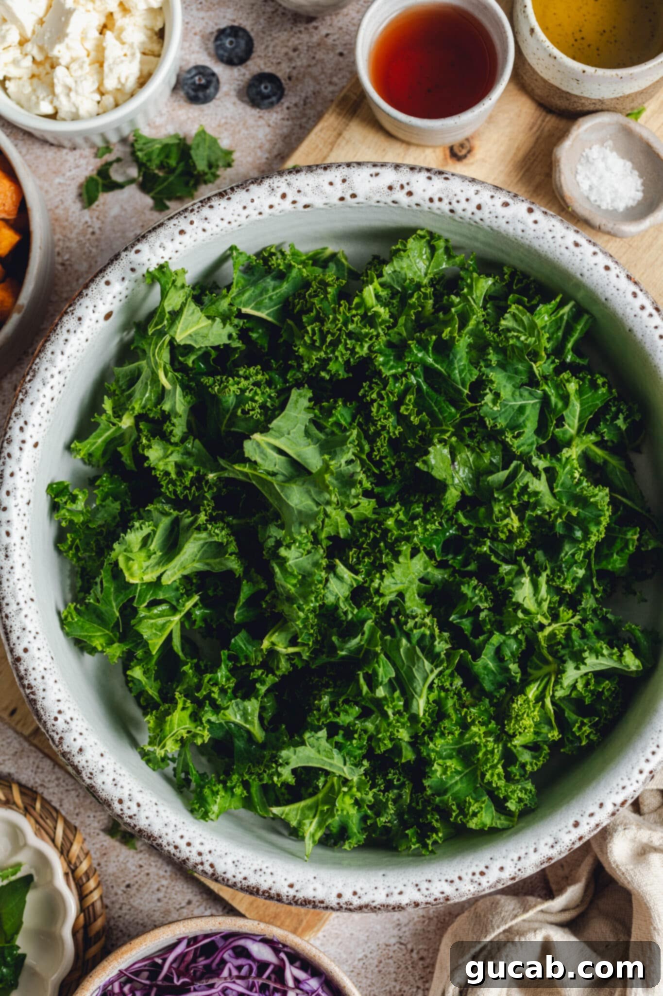 a bowl of torn kale leaves.