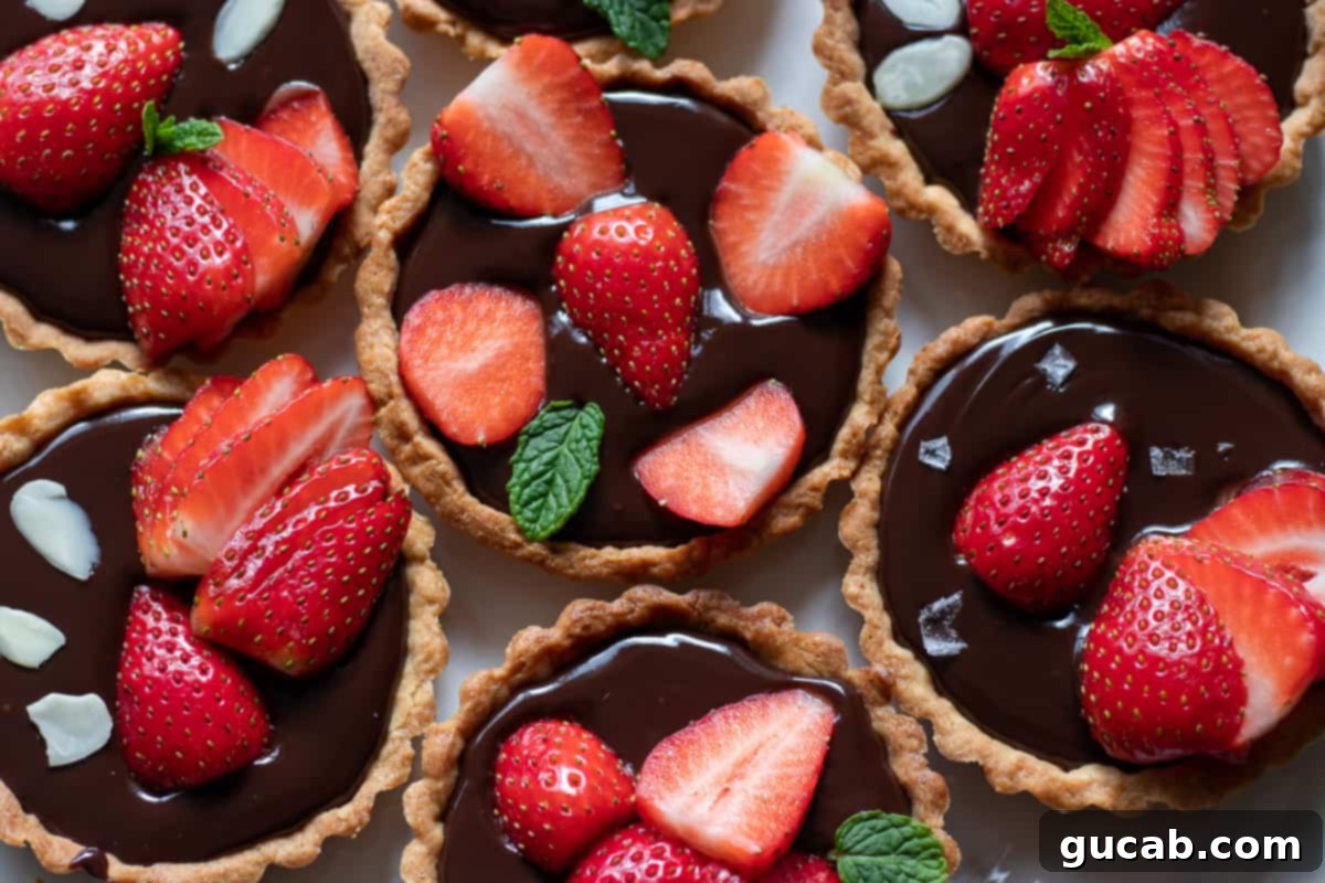 17 Heartwarming Valentine's Day Desserts 12 mini tartlets with rich chocolate ganache and perfectly sliced fresh strawberries on top