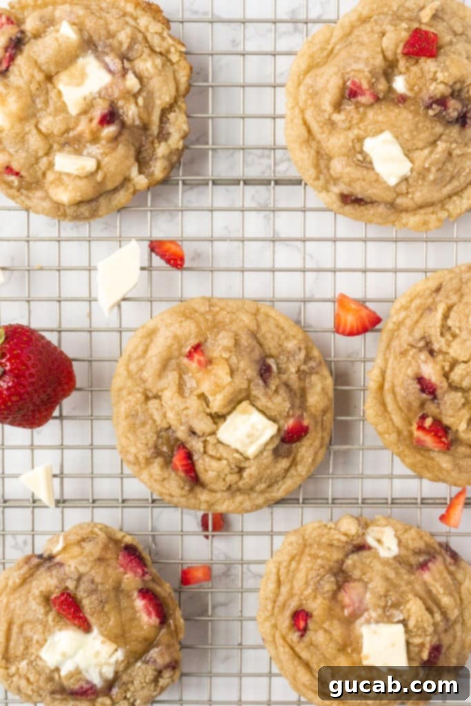 17 Heartwarming Valentine's Day Desserts 14 strawberry white chocolate cookies cooling on a wire rack, a delightful Valentine's treat
