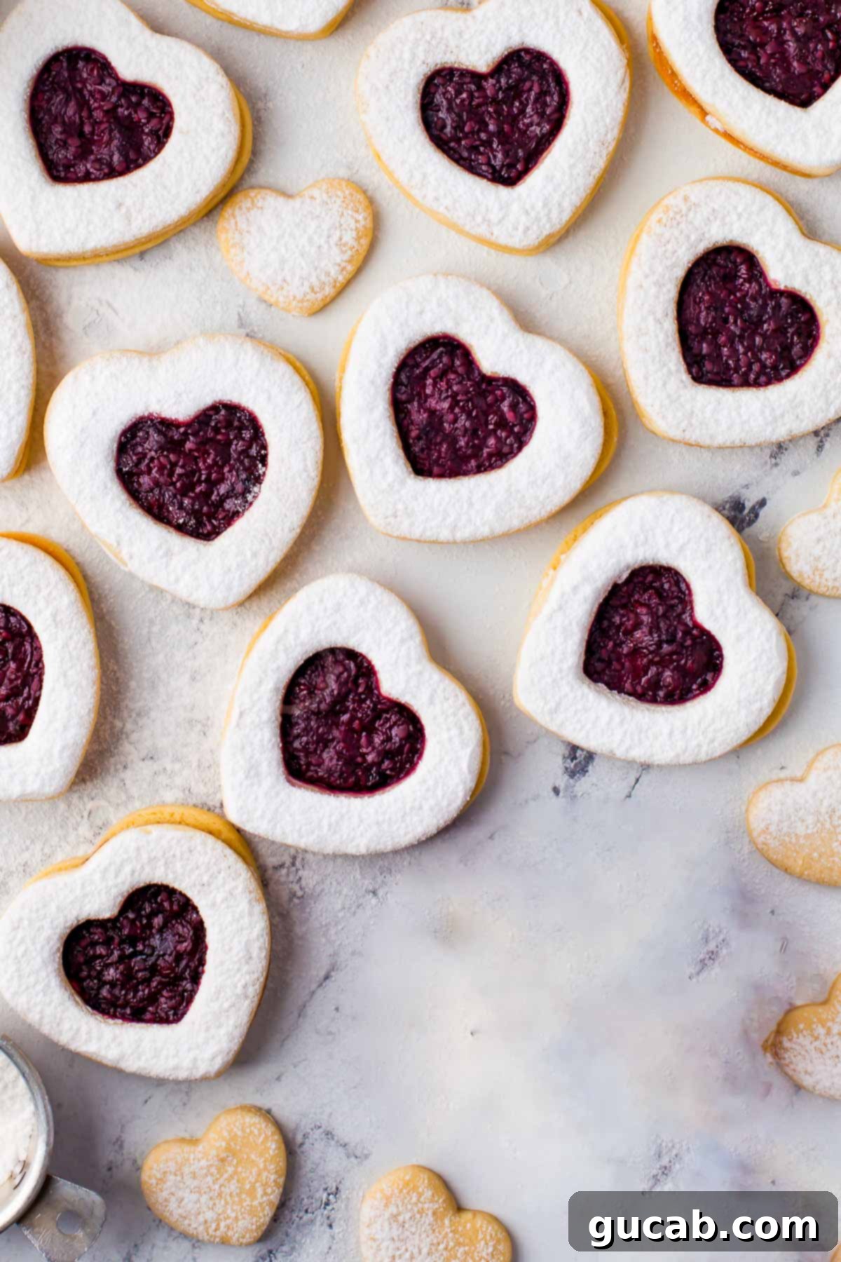 17 Heartwarming Valentine's Day Desserts 17 heart shaped Linzer cookies filled with sweet raspberry jam, a classic Valentine's cookie