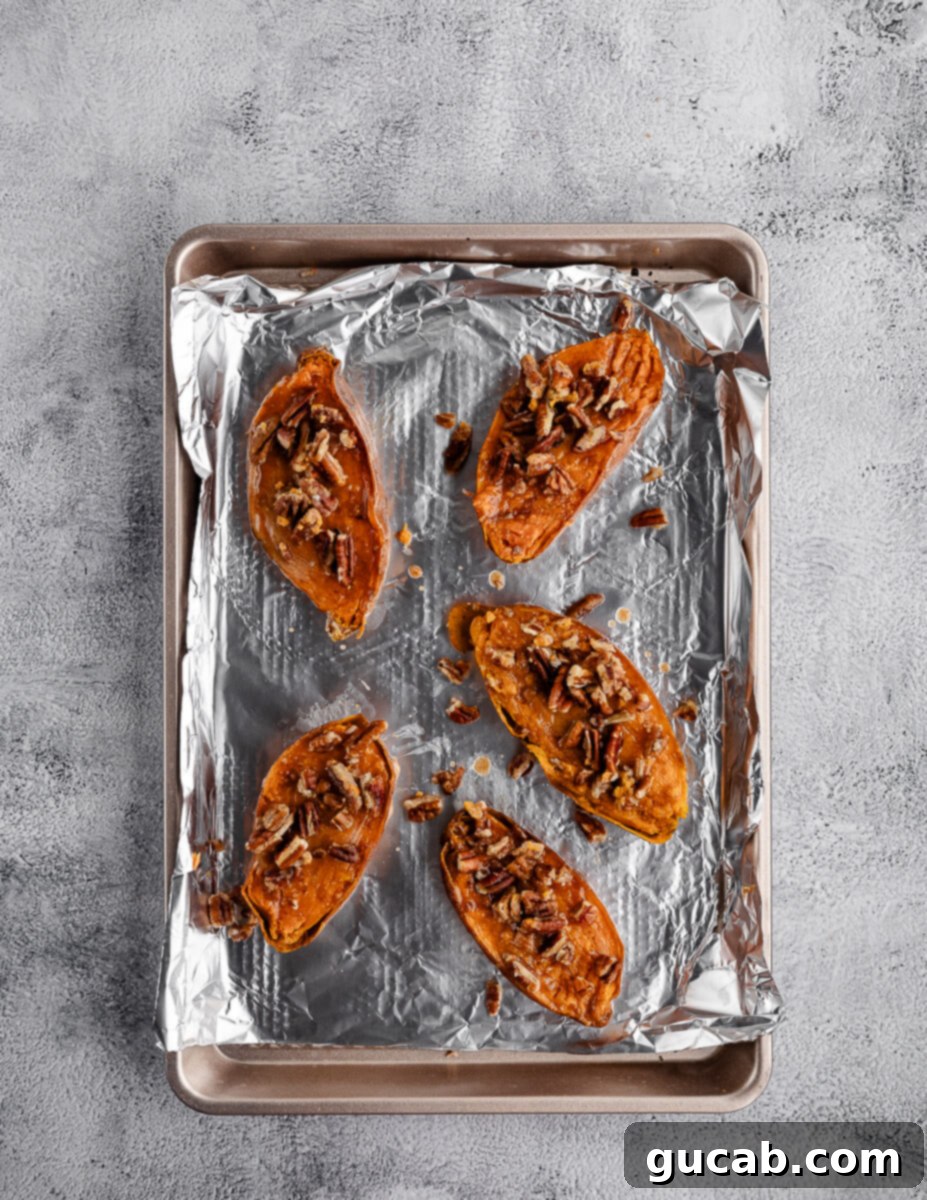 roasted sweet potatoes with cinnamon butter and toasted pecans on top. 