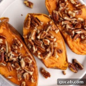 baked sweet potatoes with pecans on top.