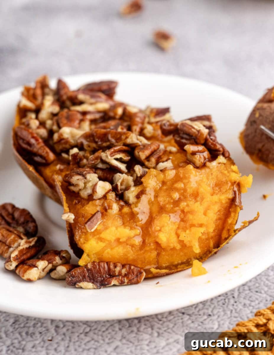half of a roasted sweet potato with cinnamon butter and pecans. 