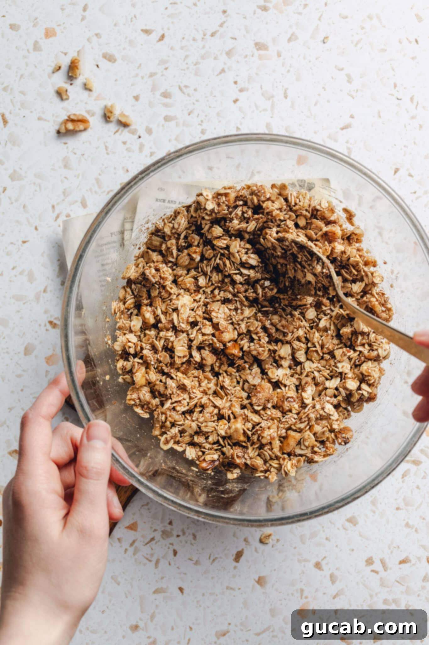 oats, walnuts, maple syrup, and coconut oil mixed together. 