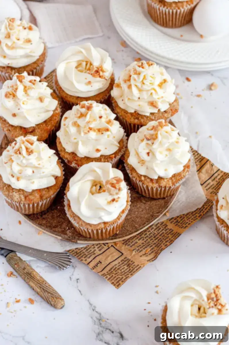 Moist gluten-free carrot cupcakes topped with fluffy frosting on a plate, ready for Easter.