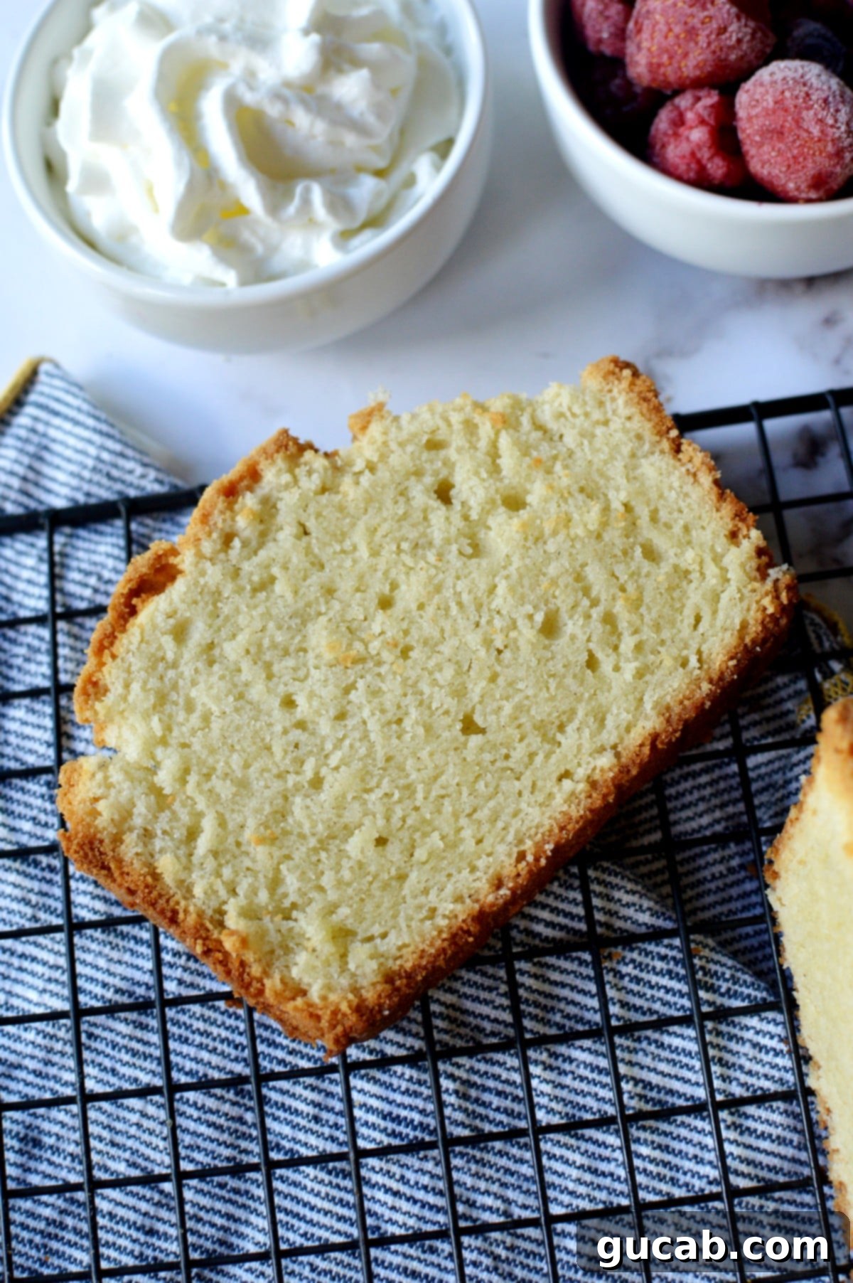 A generous slice of moist gluten-free pound cake, showcasing its dense yet tender crumb.