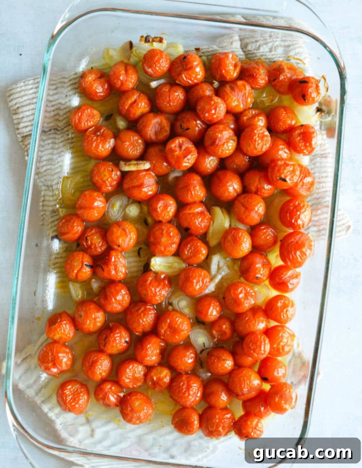 Cherry Tomato Soup 7 Perfectly roasted cherry tomatoes, tender shallots, and caramelized garlic in a baking dish, freshly removed from the oven and glistening with flavorful juices.