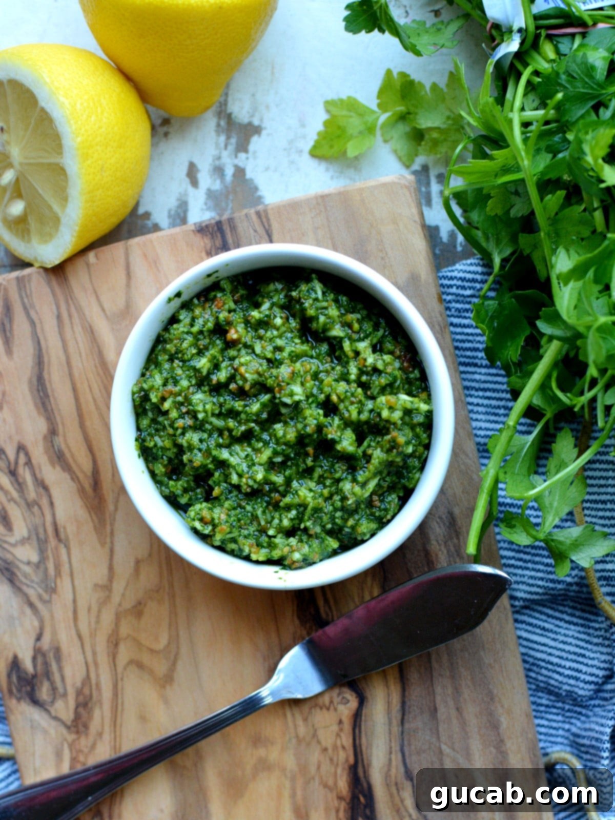 Vibrant Cilantro Mint Pesto 3 A close-up shot of homemade cilantro mint pesto in a small ceramic bowl, ready to be served.
